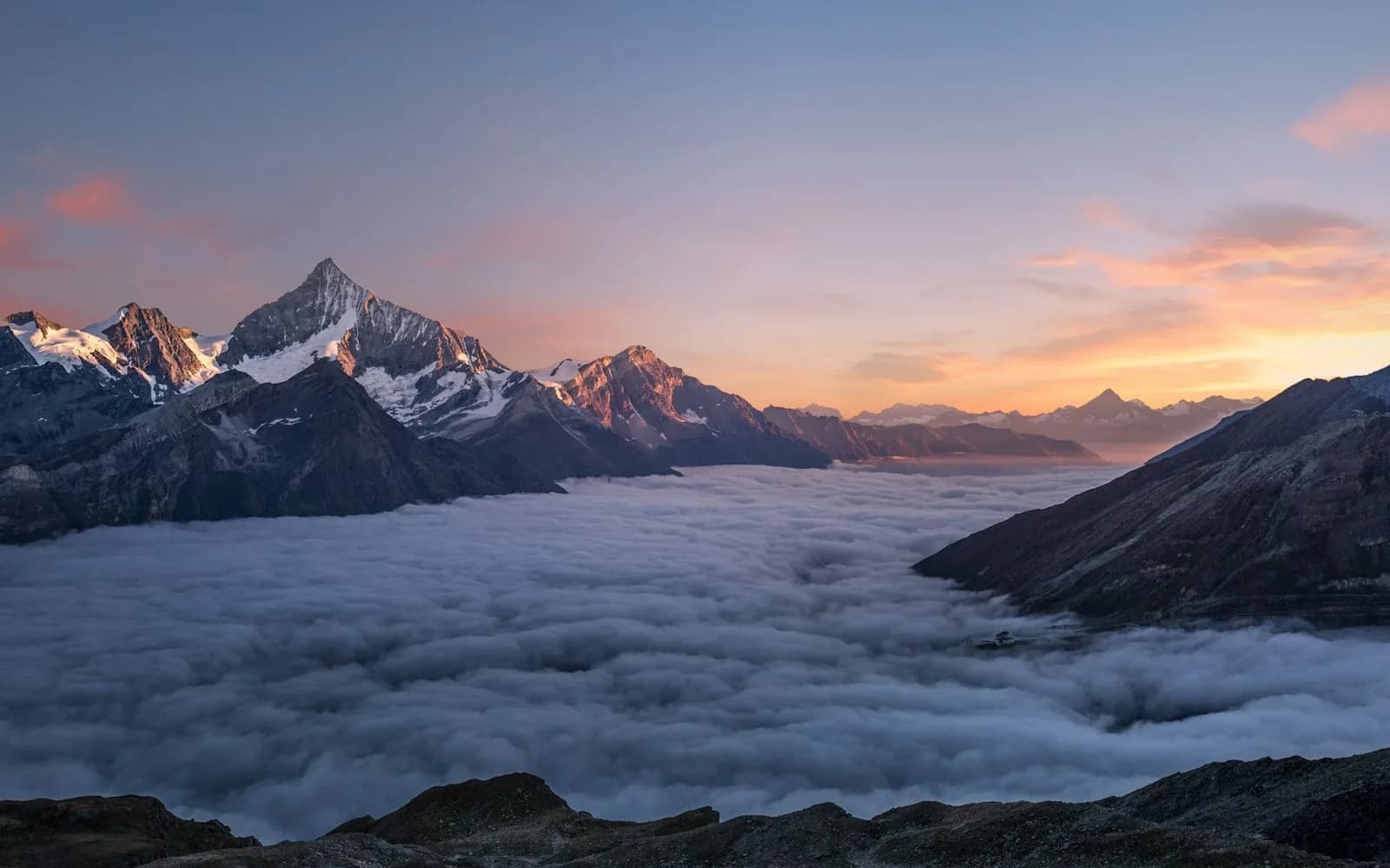 A still mountain lake at dawn